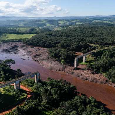 Muddy river and destroyed railroad bridge